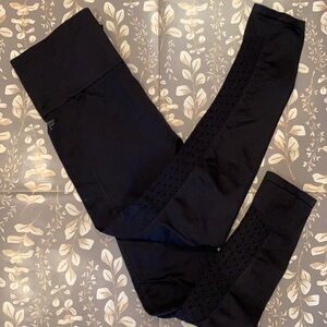 Fabletics leggings. Black. Design on lower leg. Small.